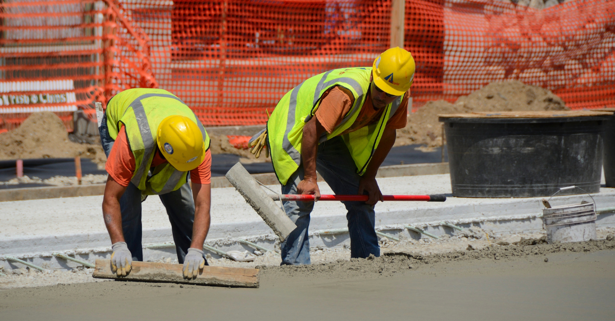 workers paving road